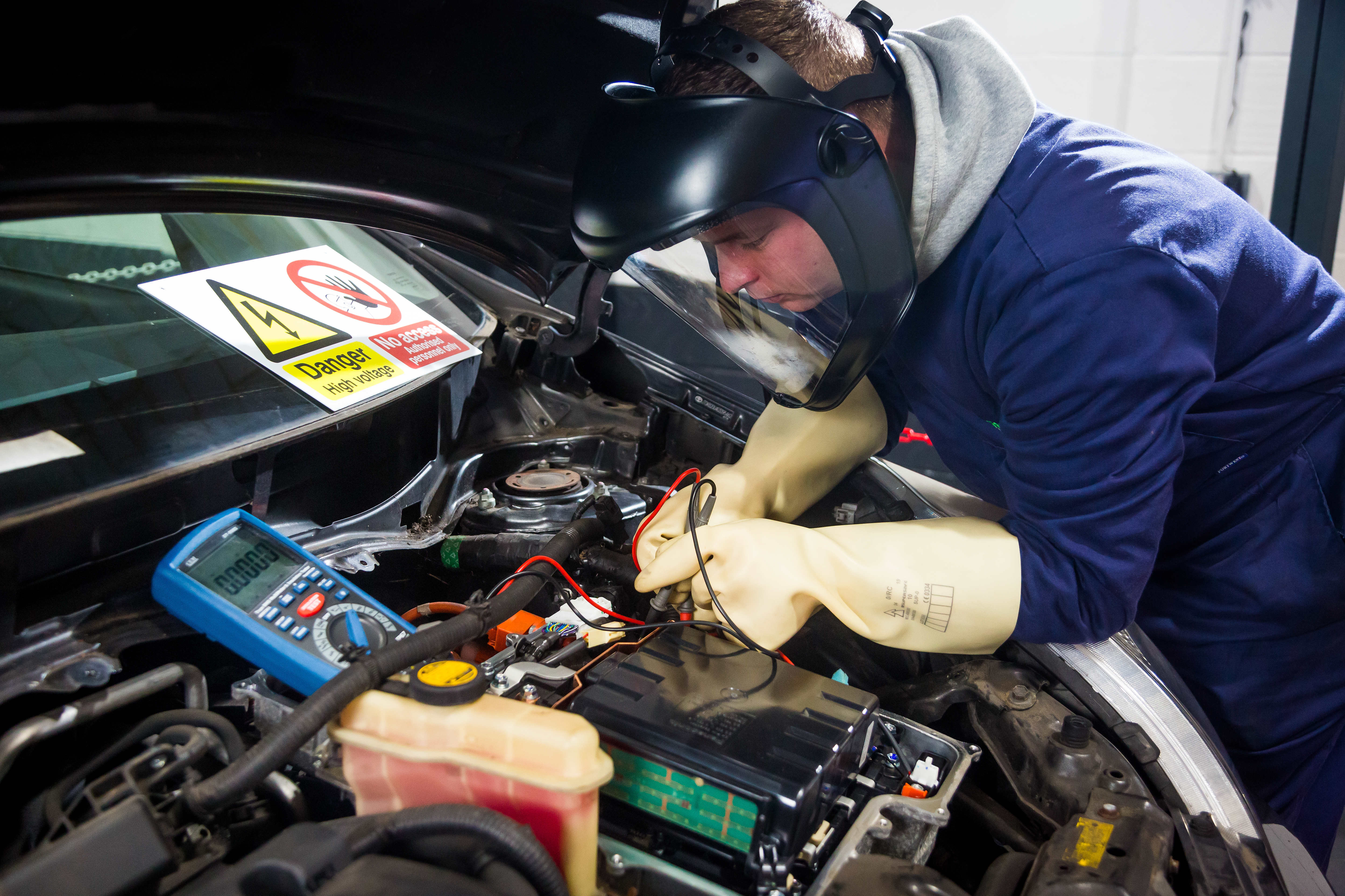 Technician working on EV