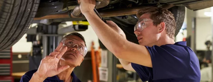 Mechanic under car