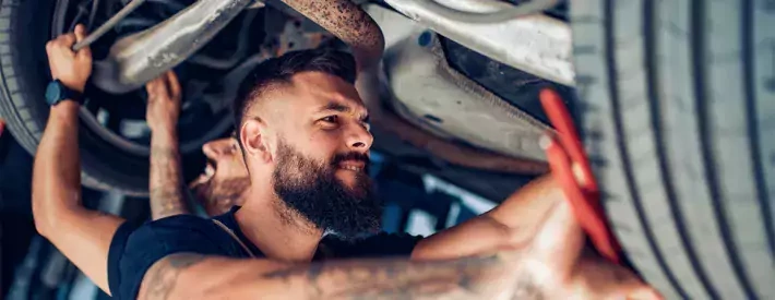 Mechanic under car