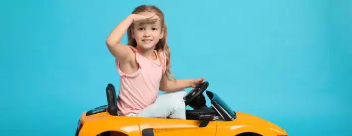 child in orange car
